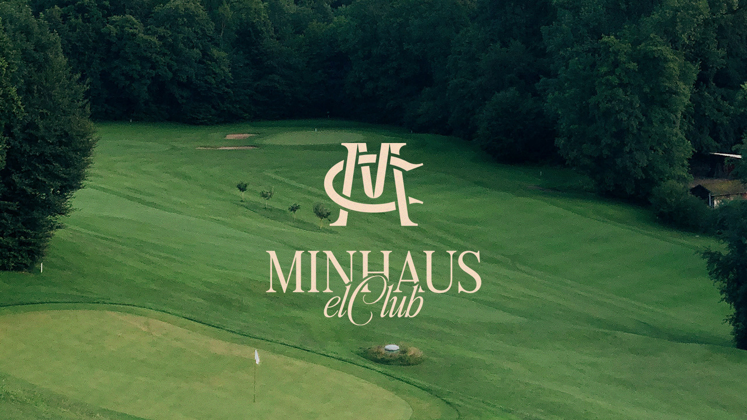 Minhaus elClub brand identity — logo on a lawn